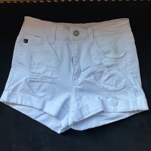 White ripped shorts.